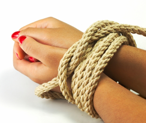 bondage rope tied around woman's wrists.