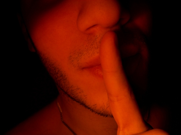 Man with Finger to Lips
