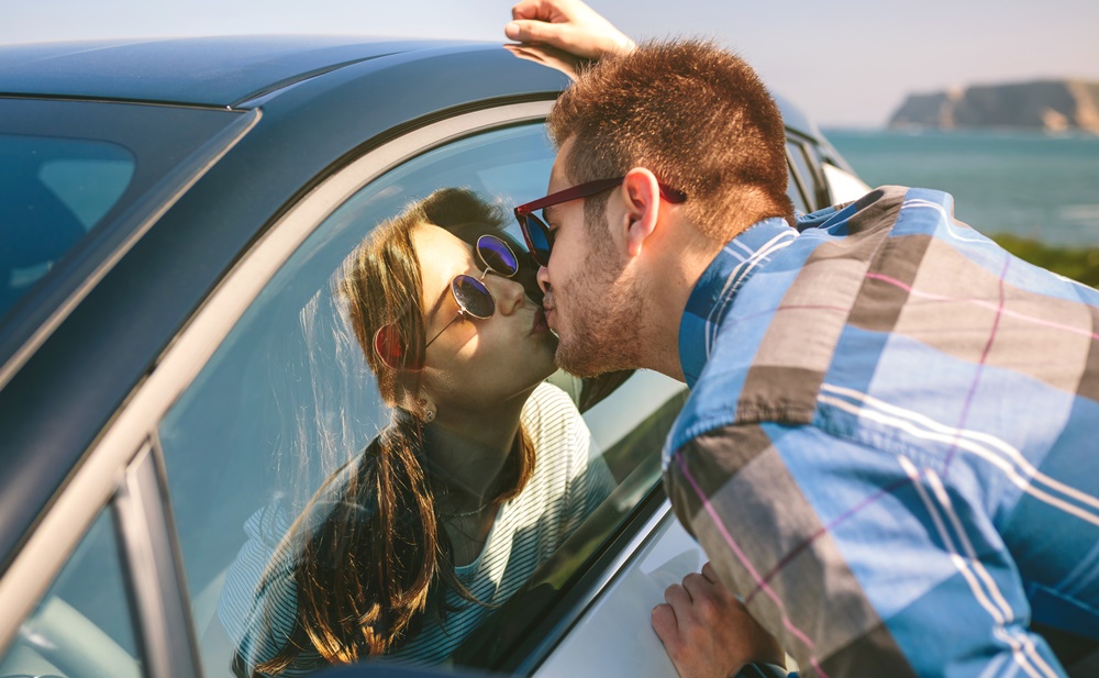 Couple Kissing through Car Window