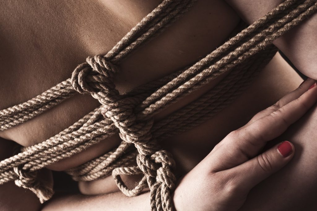 submissive woman in bondage
