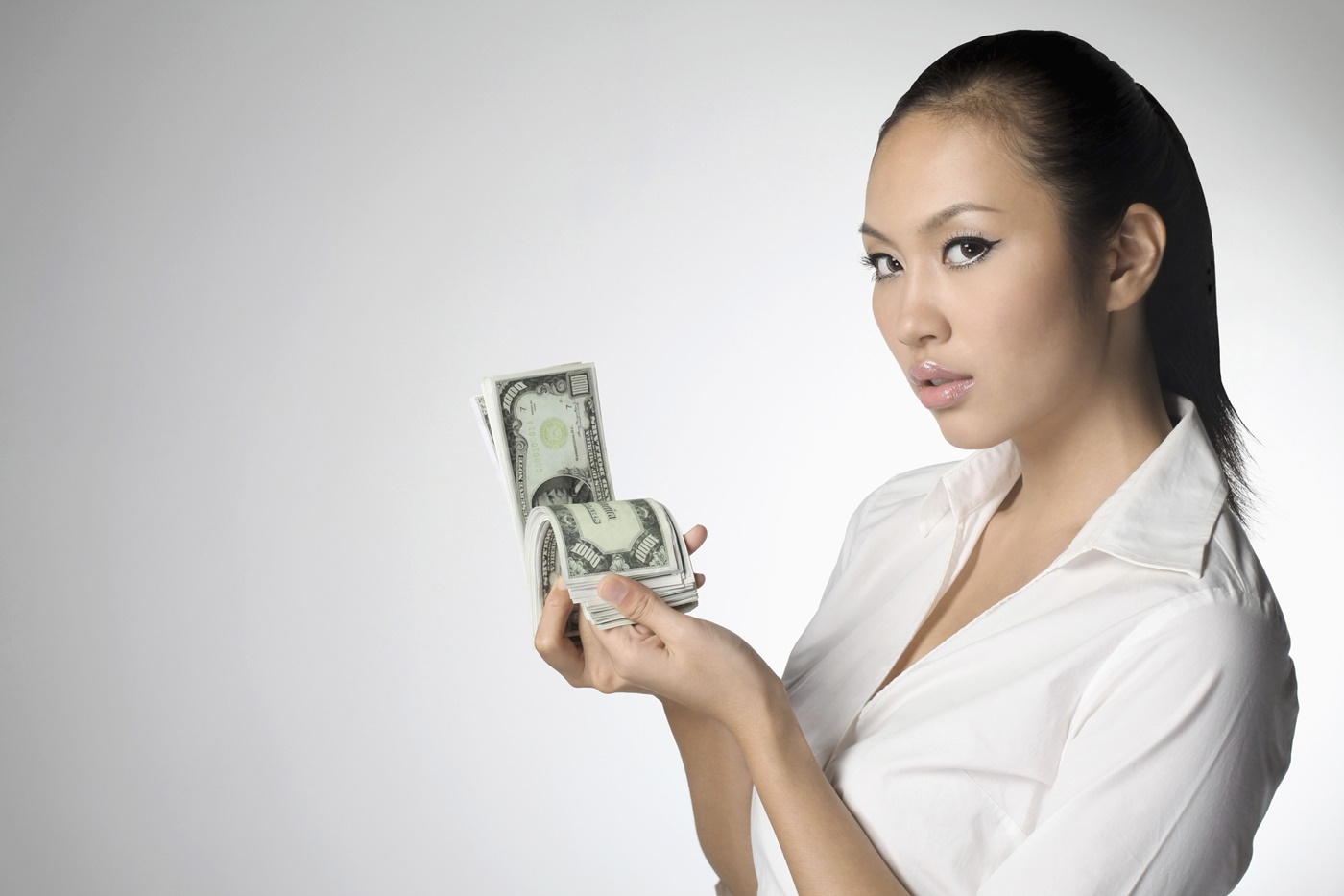 Sexy Business Woman Holding Cash