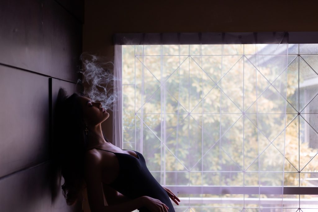 Sexy Woman Smoking in the Dark
