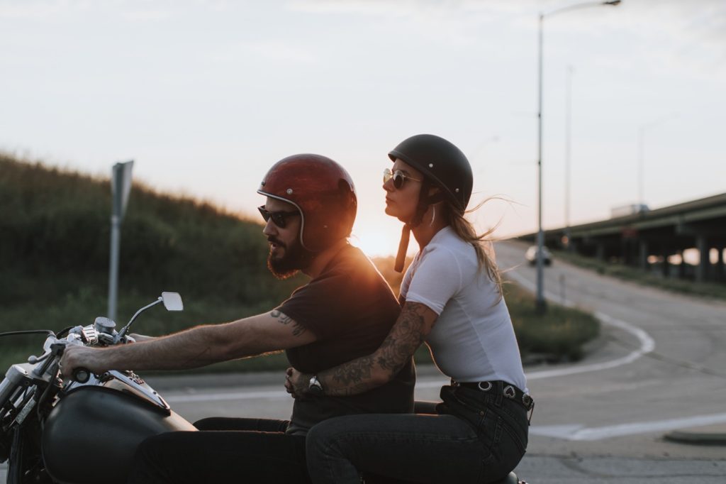 Biker Couple Riding in Sunset