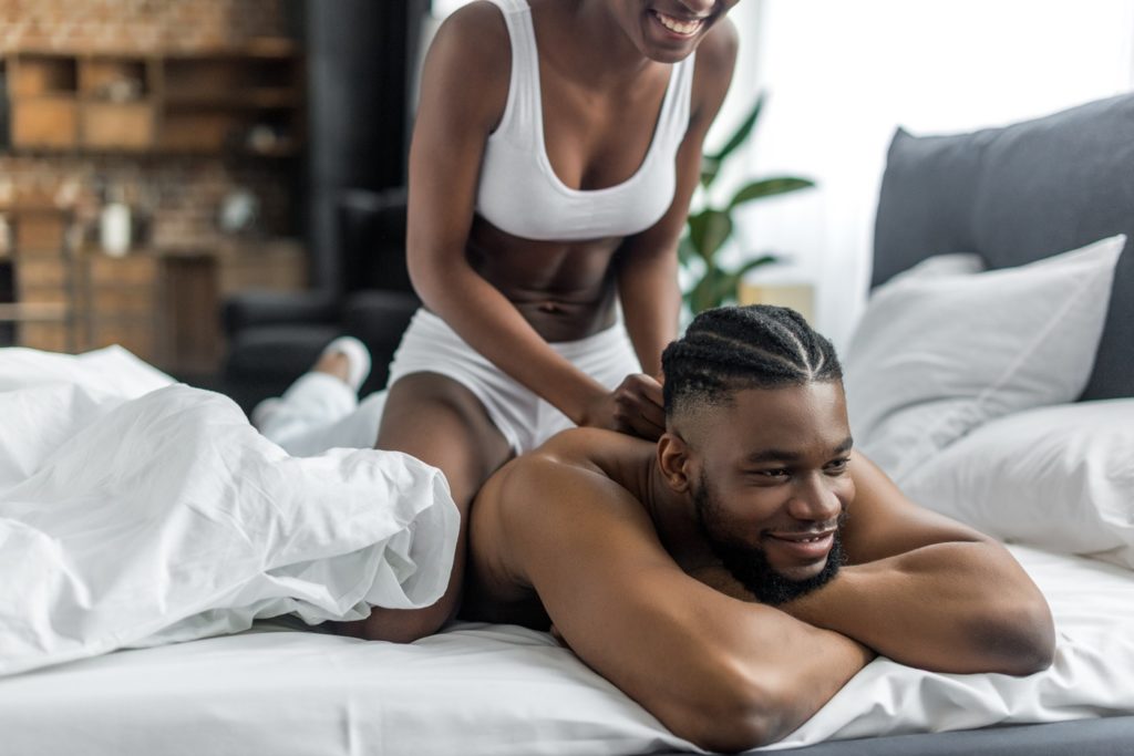 Woman Giving Her Boyfriend a Massage
