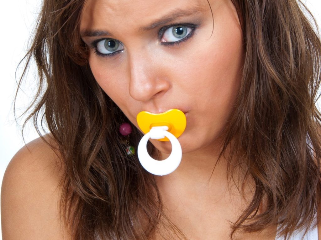 Woman with Pacifier for adult baby play