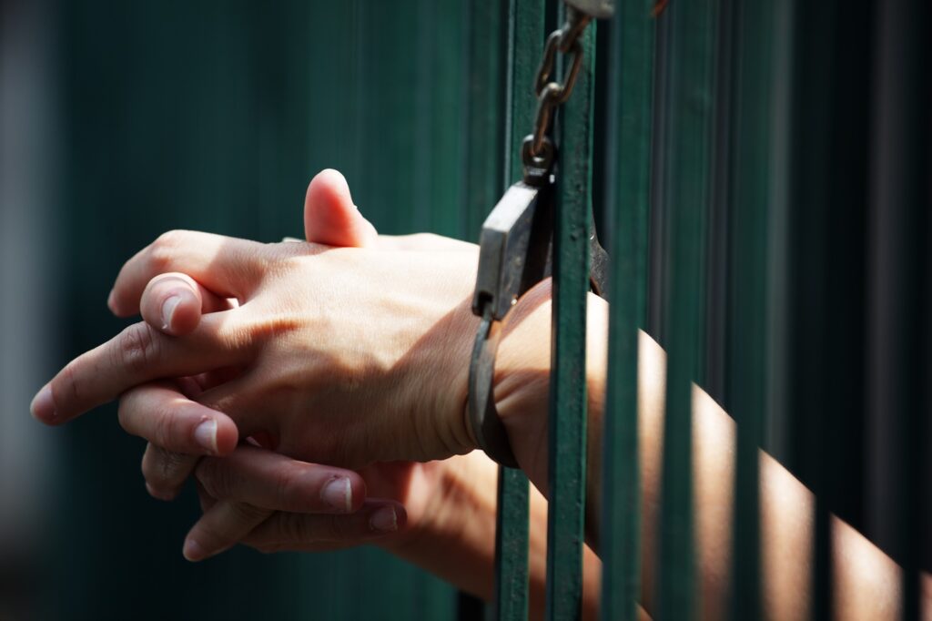Woman Prisoner in Cage