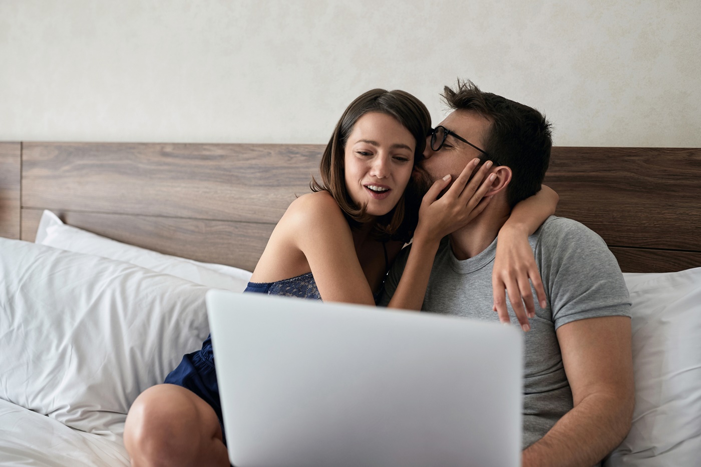 Sexy Couple Watching Laptop in Bed