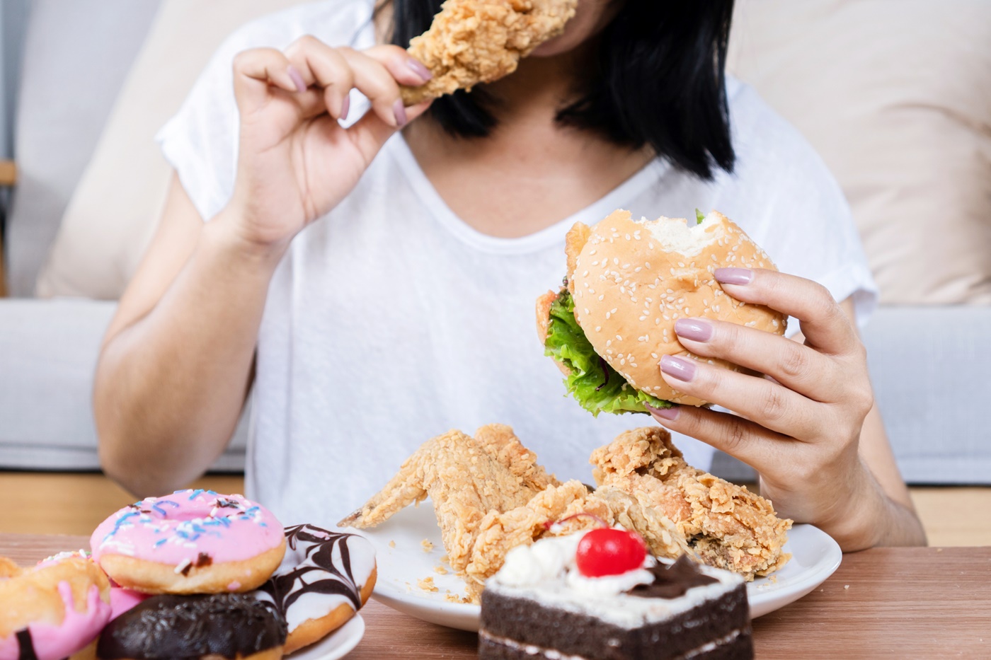 Woman Binge Eating Fast Food