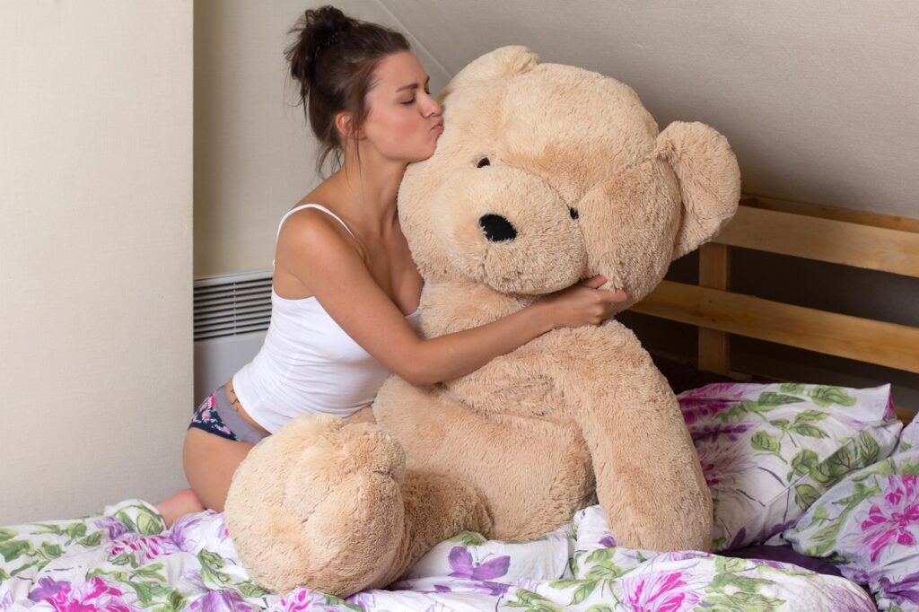 Woman Kissing Giant Teddy