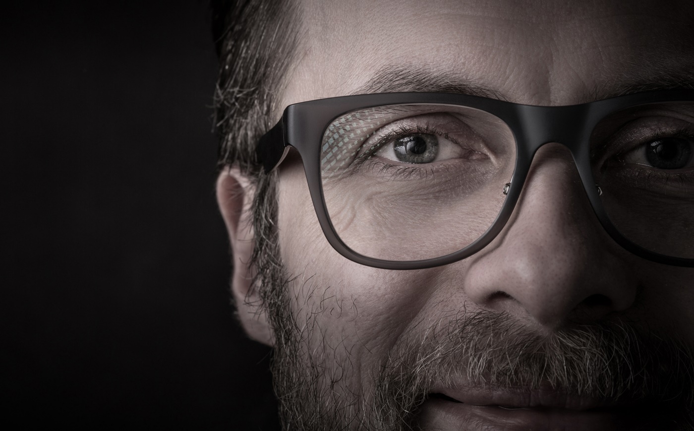 Close-up of Man Wearing Glasses