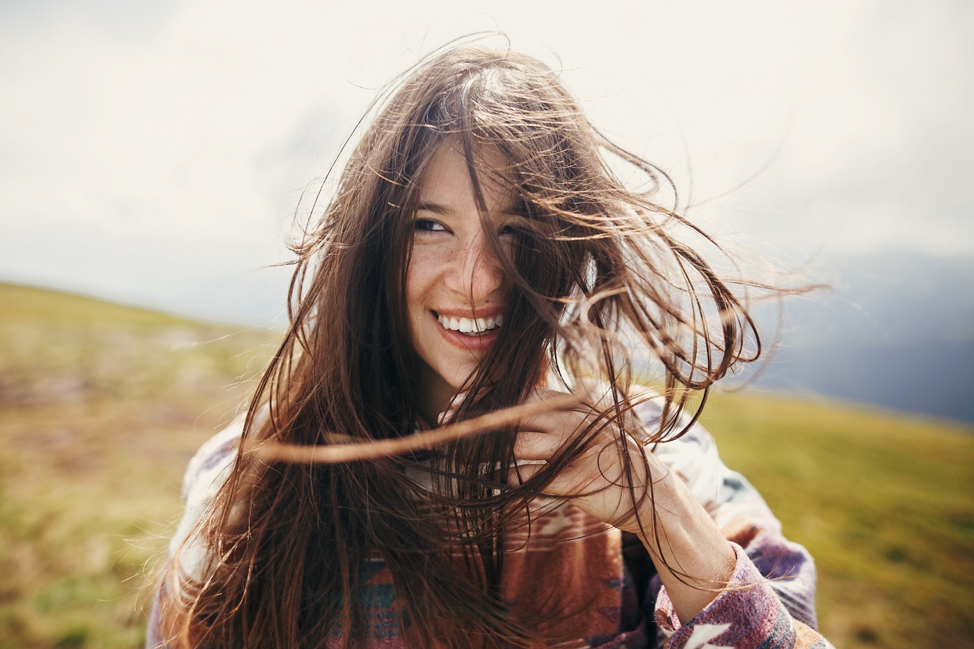 Smiling Woman with Windblown Hair